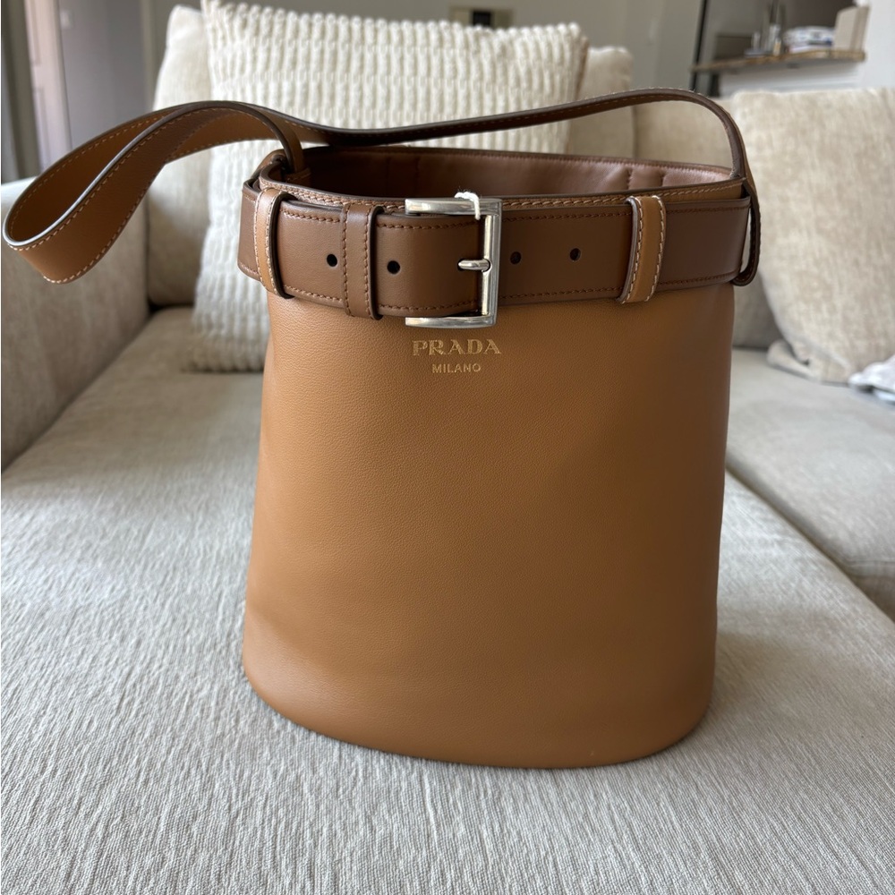 Prada belted bucket bag in caramel